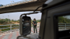 Thai military personnel keeps guard along the Moei river on the Thai side, next to the 2nd Thai-Myanmar Friendship Bridge, in Thailand's Mae Sot district