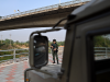 Thai military personnel keeps guard along the Moei river on the Thai side, next to the 2nd Thai-Myanmar Friendship Bridge, in Thailand's Mae Sot district