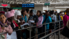 Travelers, primarily migrant workers, are waiting in line at the Bole International Airport in Addis Ababa, Ethiopia.