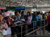 Travelers, primarily migrant workers, are waiting in line at the Bole International Airport in Addis Ababa, Ethiopia.
