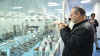 A member of a visiting delegation takes photos of a production line while visiting an agricultural company in Kashgar, northwest China's Xinjiang Uygur Autonomous Region, April 26, 2025.
