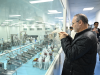 A member of a visiting delegation takes photos of a production line while visiting an agricultural company in Kashgar, northwest China's Xinjiang Uygur Autonomous Region, April 26, 2025.