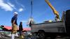 Workers load flash-frozen fish onto a vehicle at the Benoa fishing port in Denpasar, Indonesia's Bali island, on February 2, 2024.